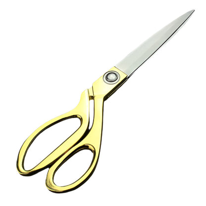 Gold-plated professional scissors for cutting cloth.